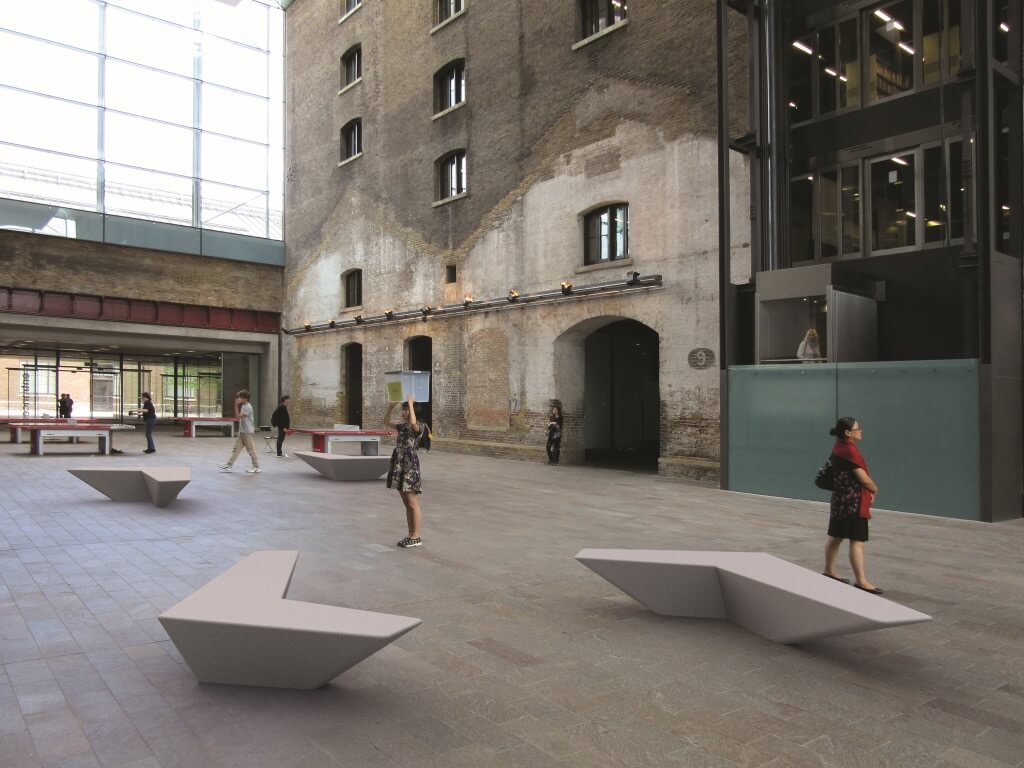 white stone terrazzo marble arrow shape angle bench seating indoor urban design 