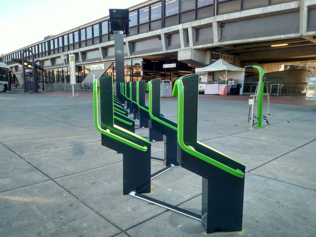 urban transit bike parking solution technology phone app locking bike parking solar powered