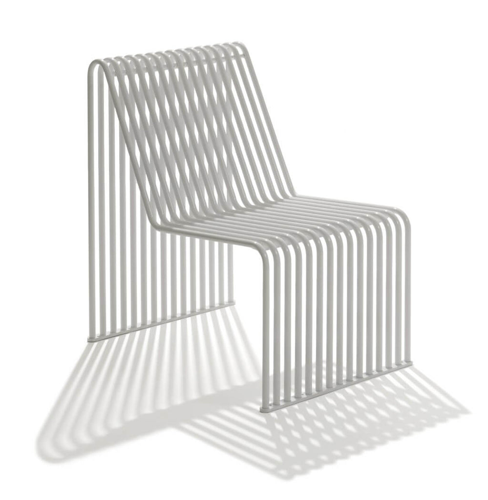 white armless chair backrest outdoor indoor metal tubing curved seat 